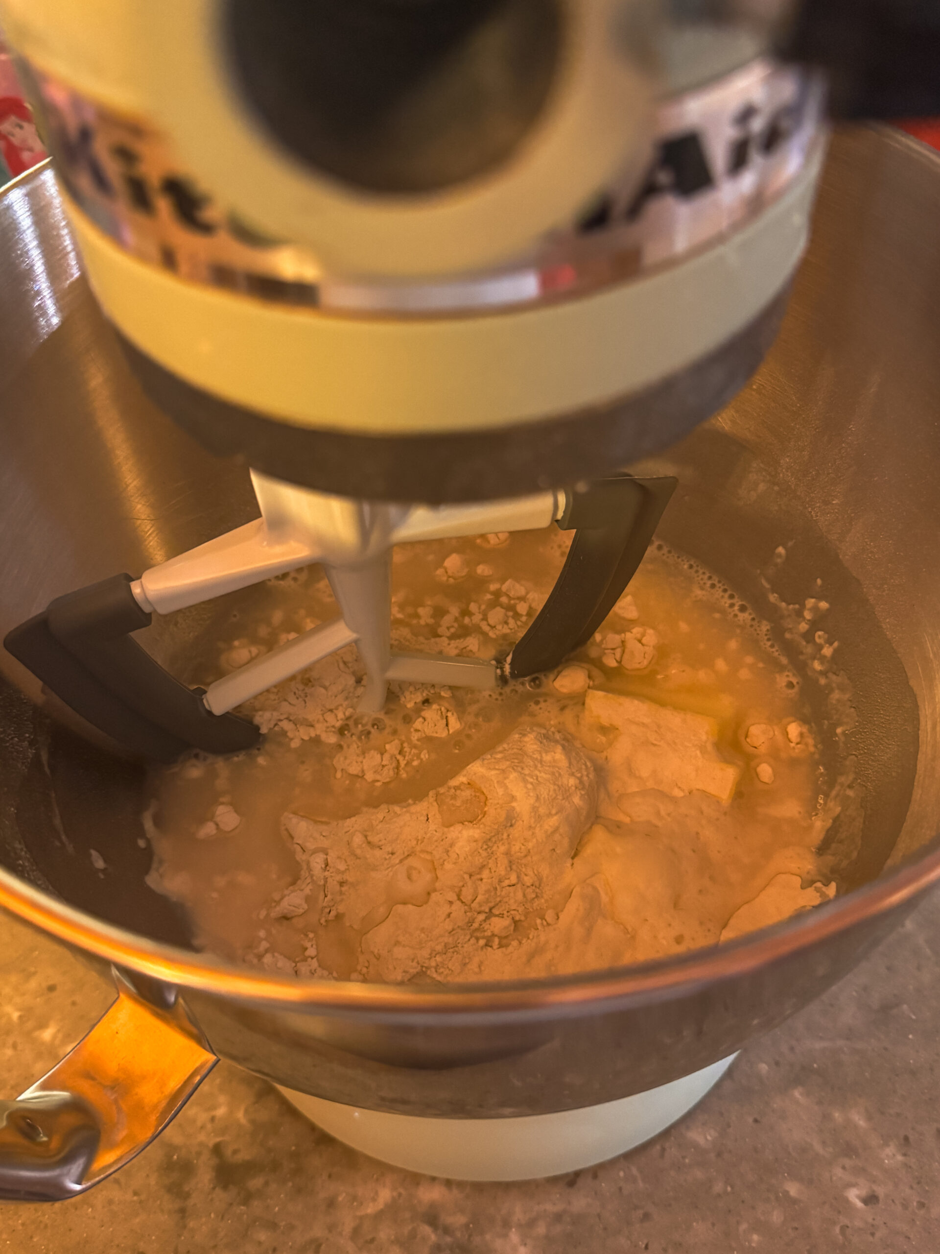 a mixer mixing ingredients in a bowl